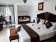 Elegant bedroom in the 2-bedroom Penthouse with king size bed, sofa bed, air-conditioning, study corner and en-suite bathroom.